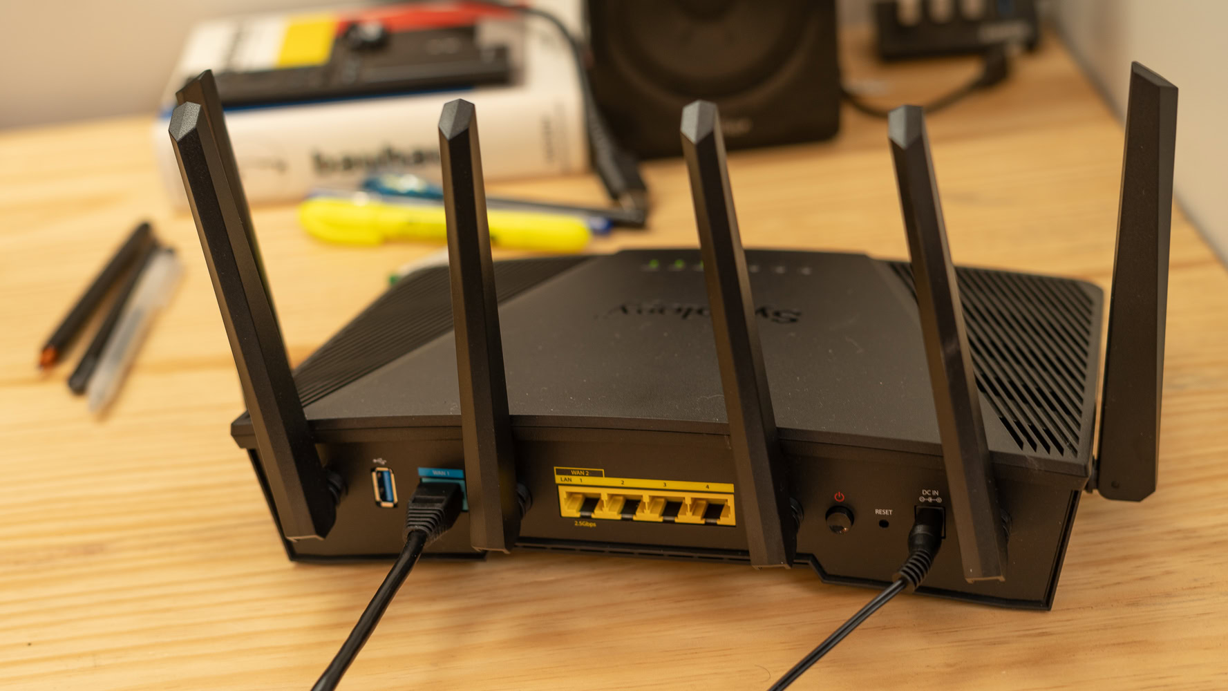 Synology RT6600ax rear of the router plugged in Synology RT6600ax rear of the router plugged in