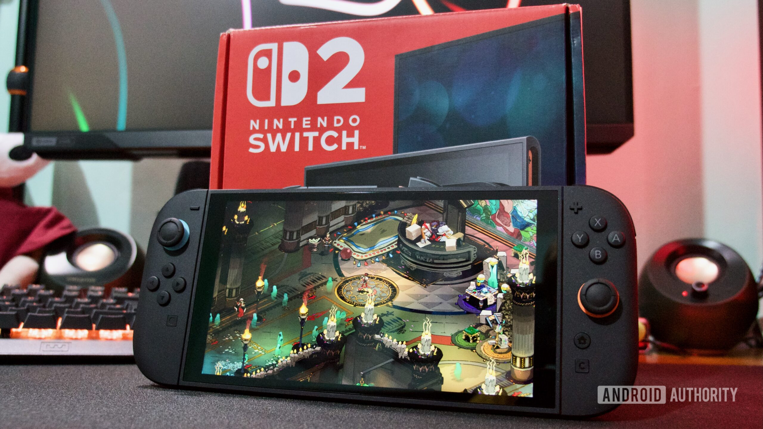 Nintendo Switch 2 in front of box hades Nintendo Switch 2 in front of box hades